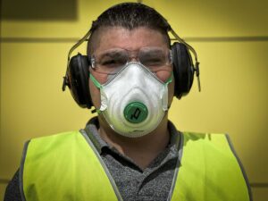 Tradie wears O2 Moulded-Fit Disposable P2 Respirator and Martula S2 Tradie Earmuff Class 5 29.2dB at Your Safety Factory