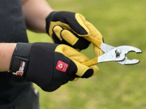 Tradie using Golden Hawk Deerskin Gloves and Golden Hawk Winterlined Gloves at Your Safety Factory