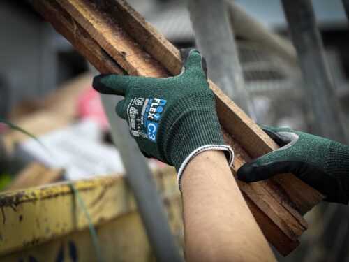 Tradie wearing NeoFlex Net Zero Gloves C3/B at Your Safety Factory