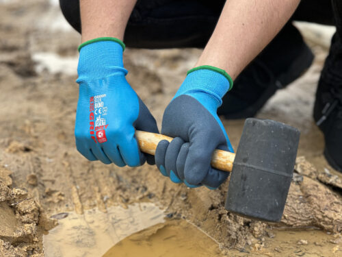 Tradie using Nexus GRIP DRY Water Resistant Gloves at Your Safety Factory