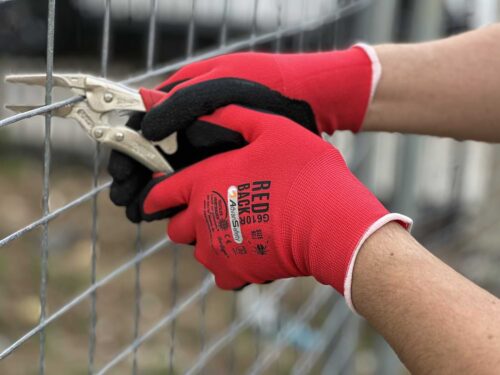 Tradie using Redbacks Nylon Gardening Gloves at Your Safety Factory