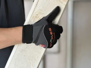 Tradie using Snakes Mechanics Gloves at Your Safety Factory